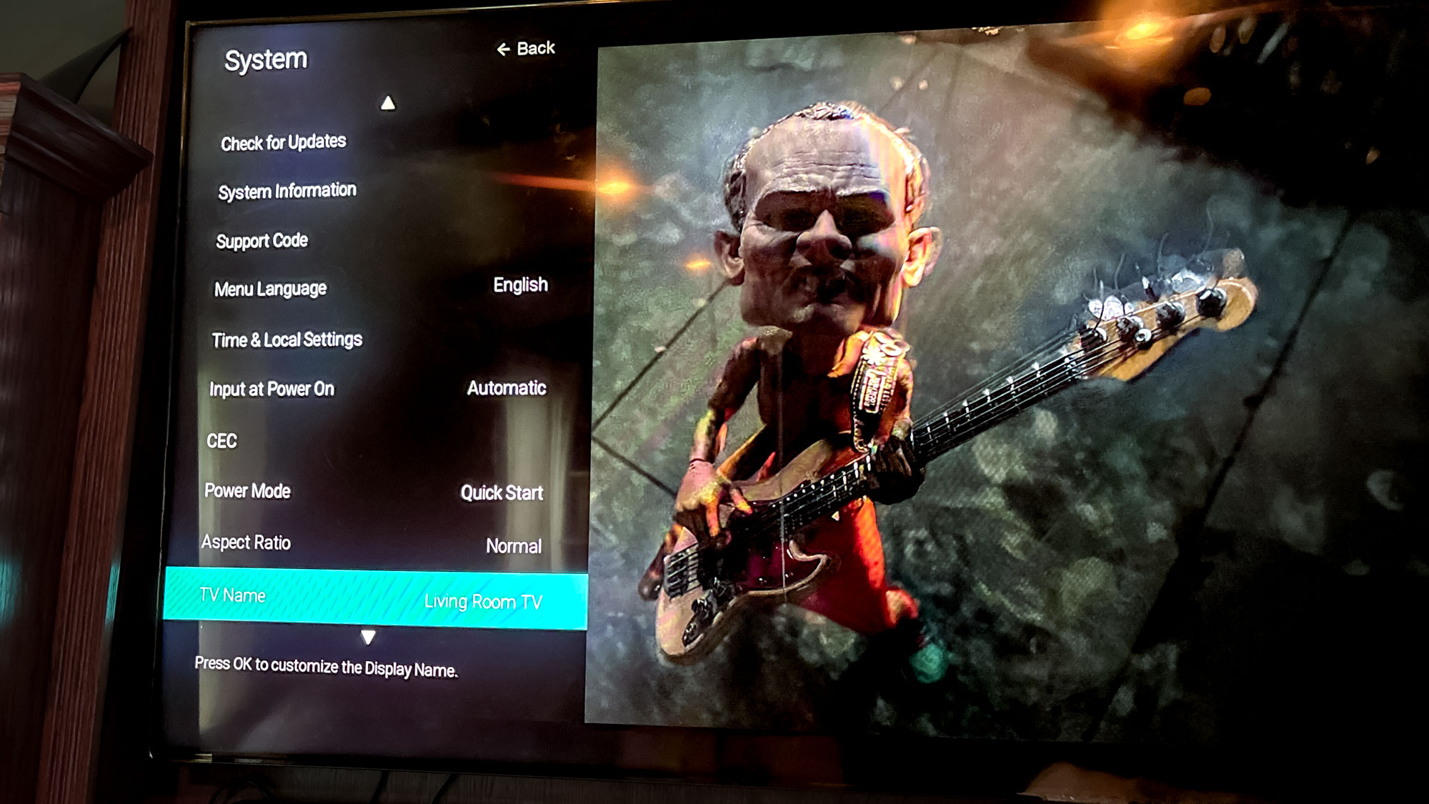 Vizio P-Series Quantum x TV sur stand dans le salon