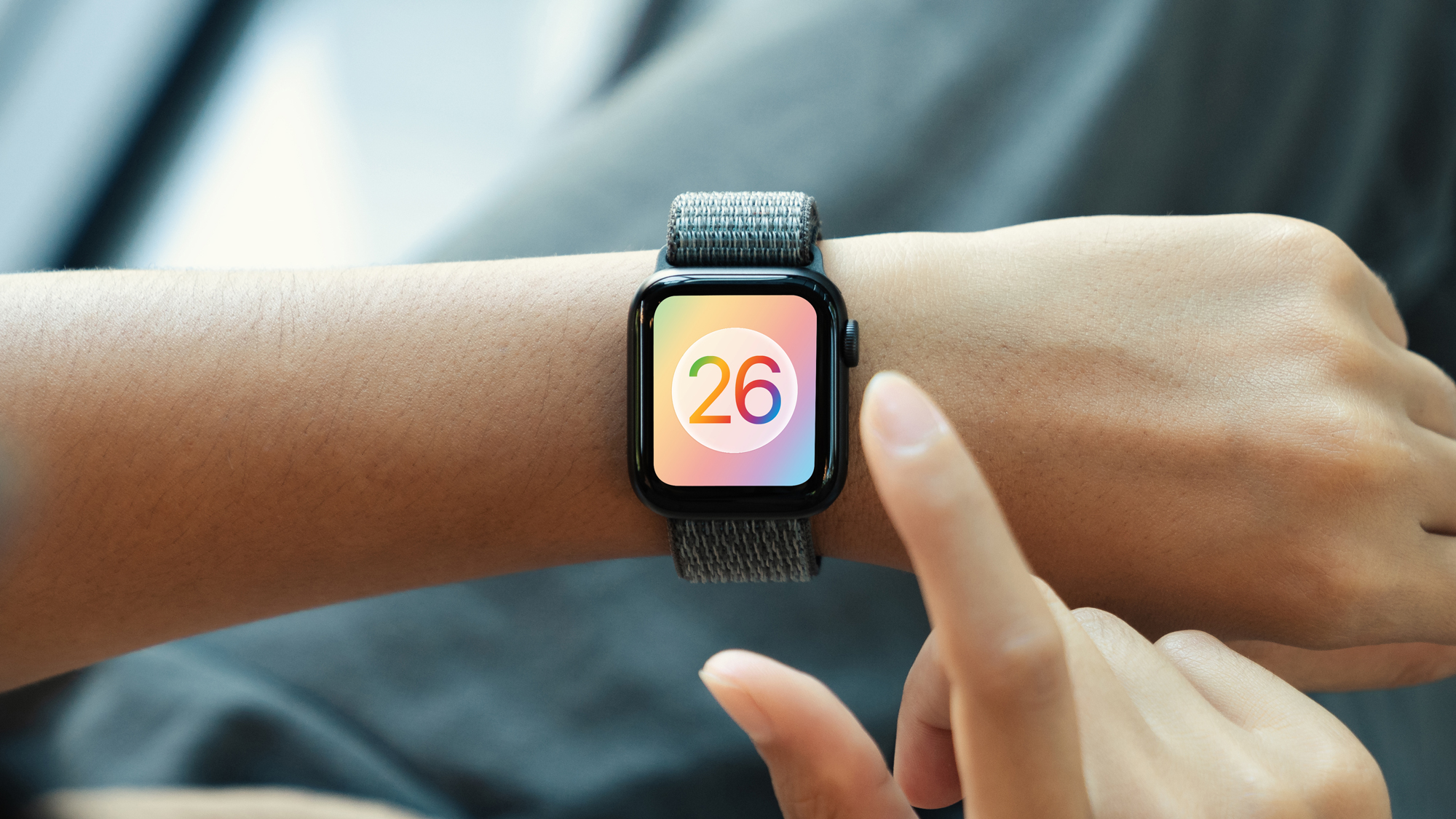 Un rendu du logo Watchos 26 sur une montre Apple.